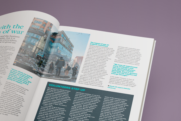 A magazine spread featuring a vibrant photo of diverse individuals engaging on a lively city street.