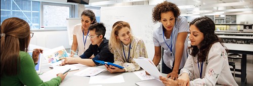 Teacher with a group of university students, in a laboratory classroom