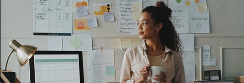 business woman standing and looking contemplative